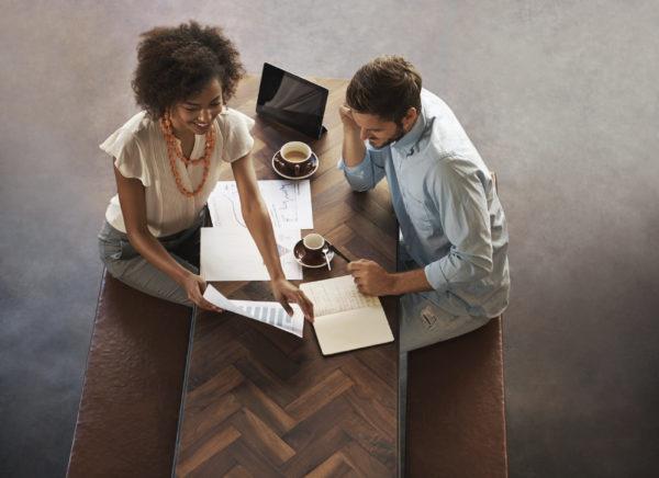 Female and male employees have a meeting