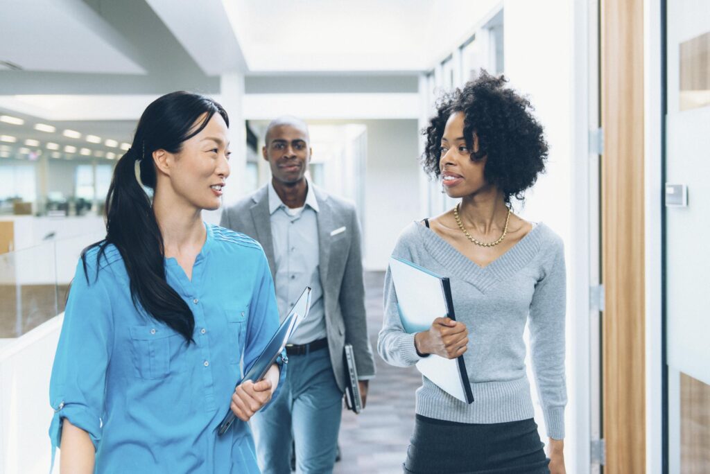 Multiracial business team going to a meeting in modern office
