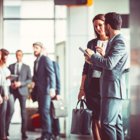 Group of business people in the office building lobby.