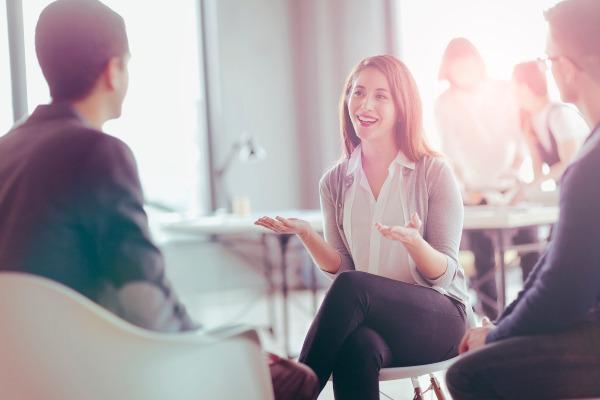 Woman being interviewed in an office