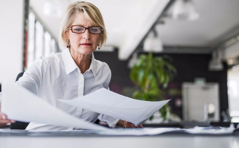 Female office worker handles paperwork