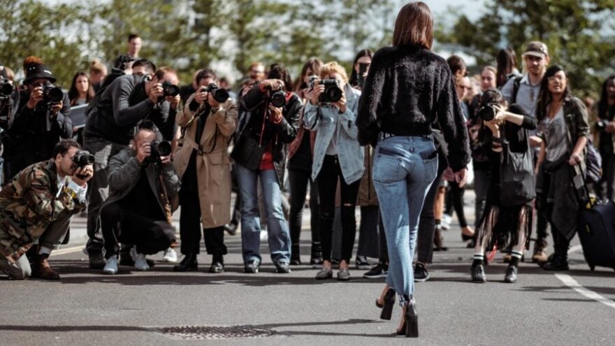 Celebrity walks towards paparazzi