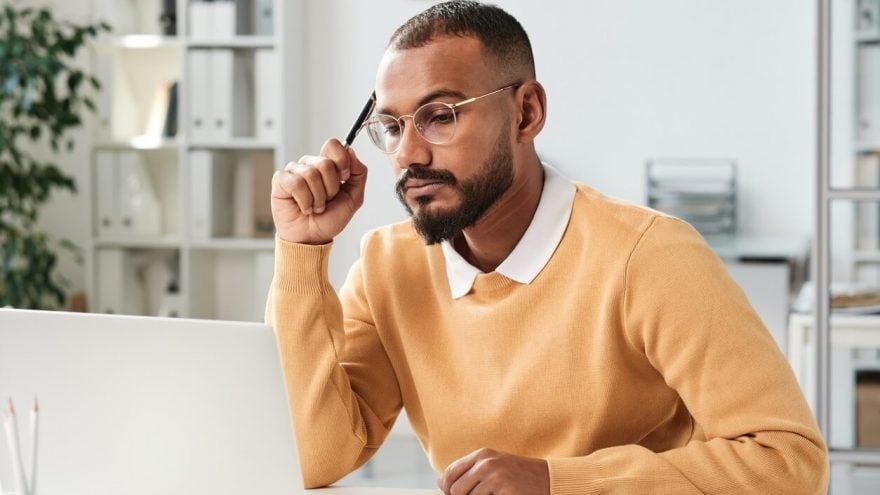 Man working on a laptop in an office