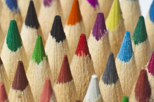 Pencil tops in different colours including green, blue, yellow, purple, red and black symbolising diverse hiring.