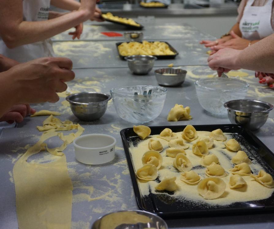 Hands making pasta