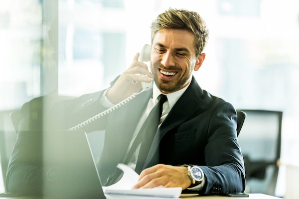 Man smiling at desk