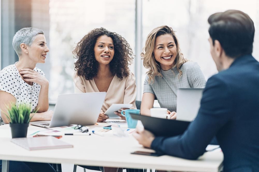 A group of HR employees conducting a panel interview