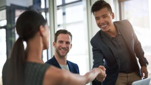 Shot of businesspeople shaking hands in an office