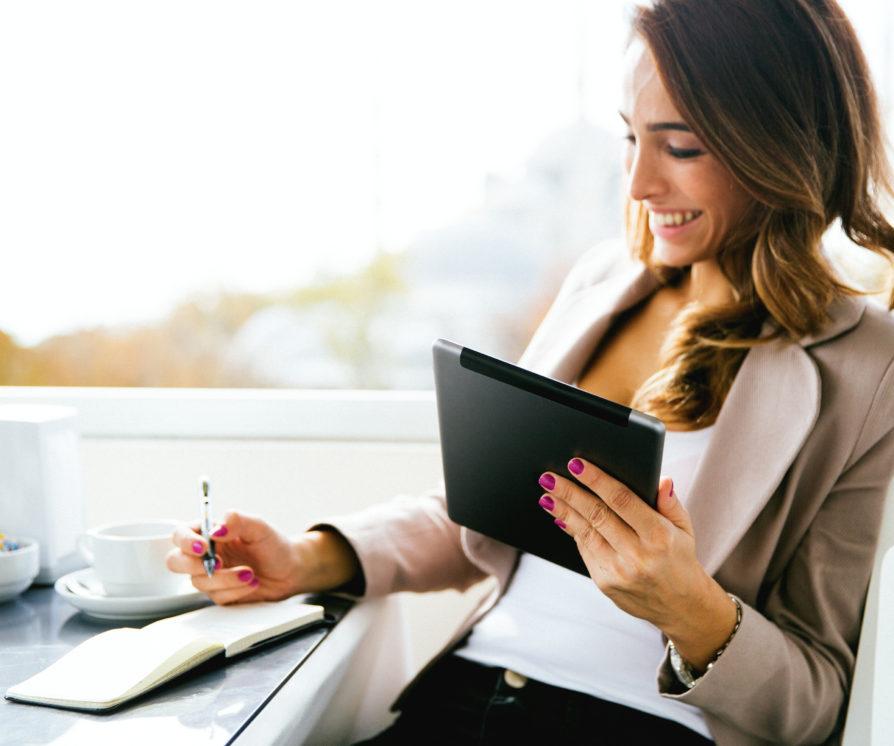 woman working outside, having a coffee