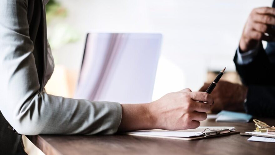 Image of two people's hands at a job interview