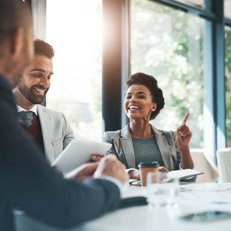Three business people having a meeting in an office.
