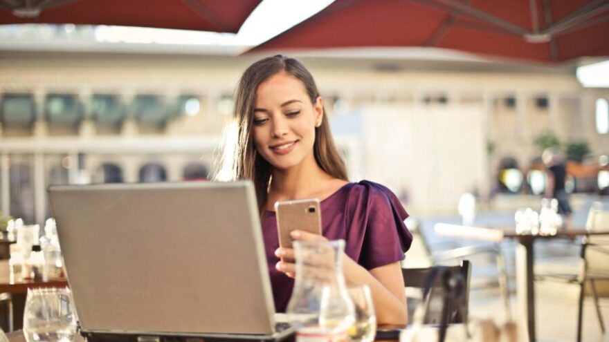 virtual assistant working on computer in cafe