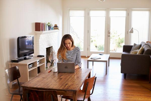 Woman sitting at her desk in her house
