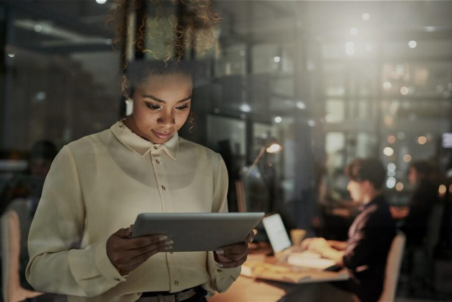 Woman-looking-at-tablet-darkened
