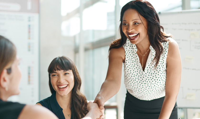 professionals around a meeting desk interviewing