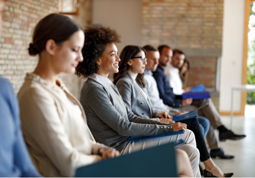 A photo of business people sat in a row