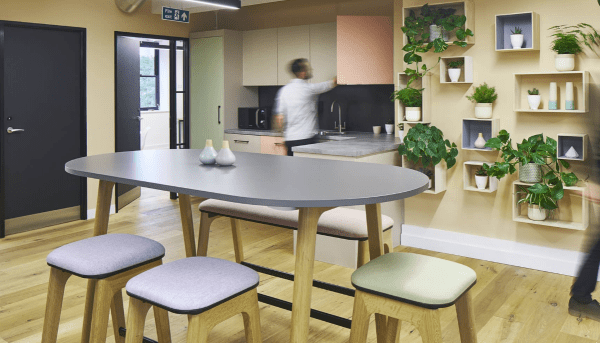 A freelance worker using the kitchen area of Uncommon coworking space.
