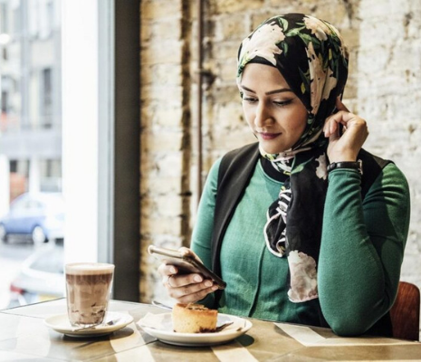 Woman on the phone in a cafe